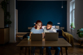 Young diverse couple running small online business at home, man and woman working on laptops - PhotoDune Item for Sale