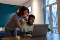Loving young woman demanding attention from busy husband working on laptop late at home - PhotoDune Item for Sale
