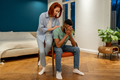 Unhappy diverse couple discussing divorce at home, solving marriage problems - PhotoDune Item for Sale
