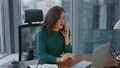 Woman manager talking smartphone at office. Lady typing laptop during phone call - PhotoDune Item for Sale