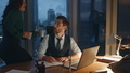 Assistant bringing drink businessman sitting at office laptop late evening. - PhotoDune Item for Sale