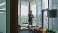 Business man thinking deal standing in office with crossing hands looking window - PhotoDune Item for Sale
