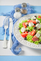 Diet and tasty Greek salad seasoned with olive oil. - PhotoDune Item for Sale
