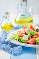 Fresh and healthy Greek salad with lettuce, tomatoes and onion. - PhotoDune Item for Sale