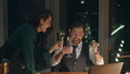 Couple coworkers drinking champagne celebrating business success at office. - PhotoDune Item for Sale