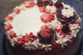 Pink cake with cream flowers on a dark background - PhotoDune Item for Sale