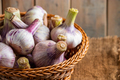 Fresh garlic on a wooden background. Fragrant spice for cooking. - PhotoDune Item for Sale