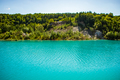 Beautiful landscape - a mountain lake with unusual turquoise water. Stone coast with green trees. - PhotoDune Item for Sale