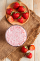 Fresh milkshake with strawberries. Summer drink with berries in a glass on wooden background. - PhotoDune Item for Sale