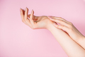 Beautiful female hands on pink background. Spa and body care concept. Image for advertising. - PhotoDune Item for Sale