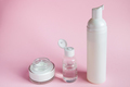 Set of cosmetics for skin care and cleansing on pink background. - PhotoDune Item for Sale
