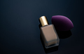 Purple makeup sponge on dark background. Soft makeup cosmetic sponge. Flat-ended makeup sponge  - PhotoDune Item for Sale