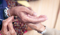 The ceremony of binding elderly people’s wrist with the holy thread to console old people's Kwan. - PhotoDune Item for Sale
