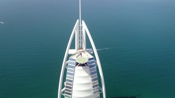 Aerial view of the top of luxurious Burj Al Arab Hotel in the bay of Dubai.