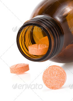 pills and bottle on white