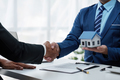Real Estate agent and client handshake after sign contract and about home insurance and investment - PhotoDune Item for Sale