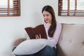 Attractive Asian woman resting comfortable living room and reading book, Relax, Sofa, Lifestyle - PhotoDune Item for Sale