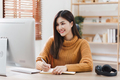 Online education, e-learning. Asian woman in stylish casual clothes, studying using a computer - PhotoDune Item for Sale