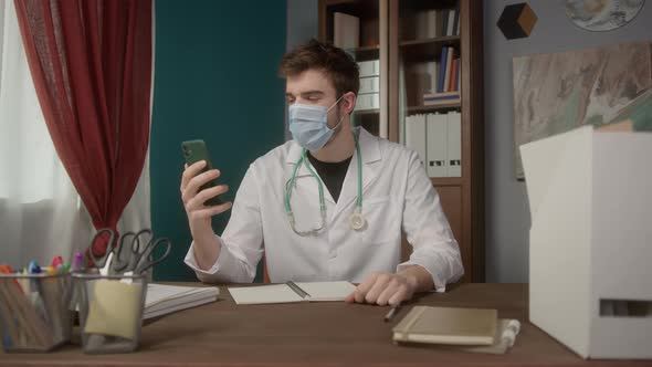Doctor Wearing Medical Mask Consultation Video Conference in Video Chat Medical App