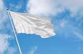 White flag waving in the wind against cloudy sky - PhotoDune Item for Sale