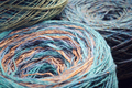 Round skeins of organic multi-coloured lambswool yarn. - PhotoDune Item for Sale