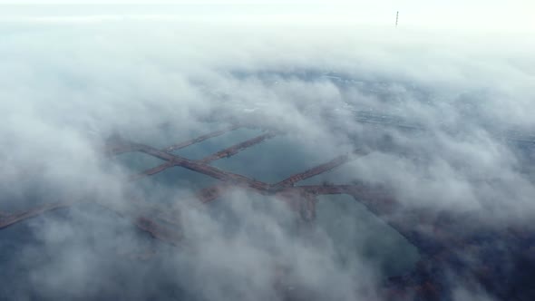 Aerial Drone View Flight Over White Clouds of Mist Artificially Created Lakes