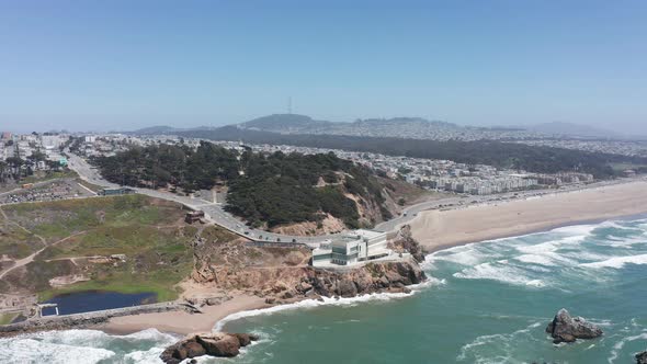 Descending aerial shot of the Cliff House at Land's End Lookout in San Francisco. 4K