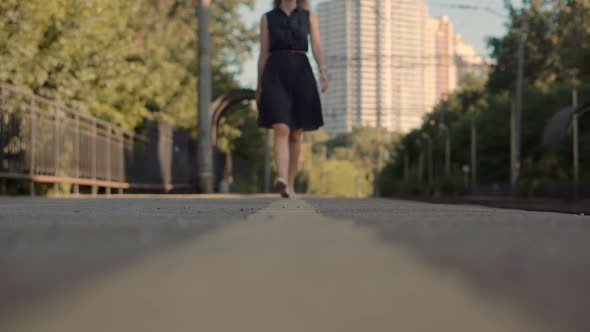 Woman In Dot Dress Walking On Railroad Station Platform. Girl Waiting Train On Public Transport