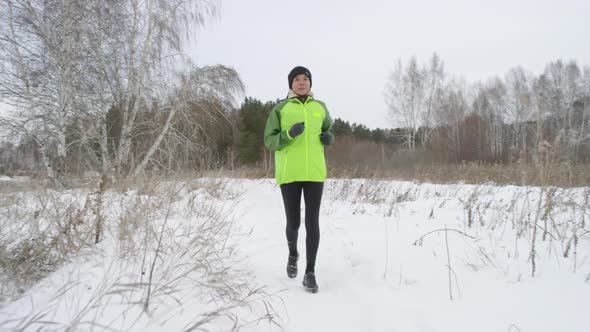 Active Woman Running in Morning in Winter