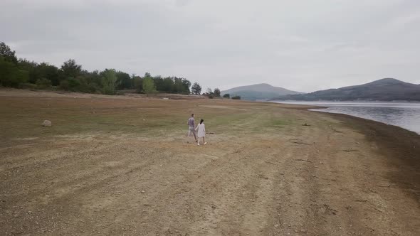 Young couple by the lake