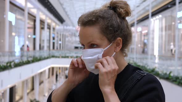 Woman Wearing Face Mask in the Shopping Mall. Shopping During Second Wave of Covid-19 Pandemic