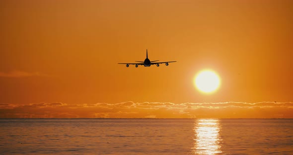 Airplane Take Off Silhouette In Sunset