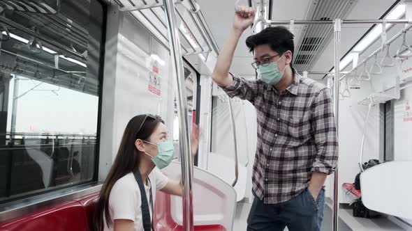 Asian face masks passengers in empty train, travel with urban railway transport.