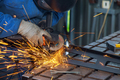 During the metalworking process of grinding metal in a factory where the master is working, the - PhotoDune Item for Sale
