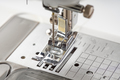 Modern sewing machine presser foot closeup, macro - PhotoDune Item for Sale