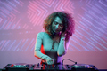 Curly haired young woman as female DJ - PhotoDune Item for Sale