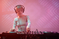 Young woman as DJ wearing headphones in nightclub - PhotoDune Item for Sale