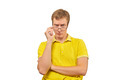 Young surprised man looking over his glasses, man in yellow T-shirt isolated on white background - PhotoDune Item for Sale