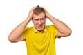 Upset young male in yellow T-shirt clutched at head, forgetful man, isolated on white background - PhotoDune Item for Sale