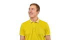 Portrait of funny young male in yellow T-shirt looking right isolated on white background - PhotoDune Item for Sale
