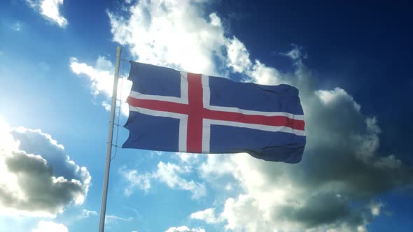 Flag of Iceland Waving at Wind Against Beautiful Blue Sky