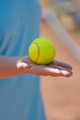 person holds a tennis ball in his hands before a game or competition - PhotoDune Item for Sale