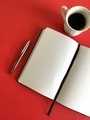 Notebook and pen with coffee on red background  - PhotoDune Item for Sale