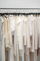 Beautiful female wardrobe. A lot of beautiful clothes hanging on hangers. - PhotoDune Item for Sale