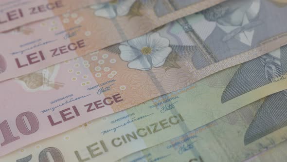 Lei paper money of Romania close-up 3840X2160p 30fps UltraHD video -Tilting on Romanian national cur