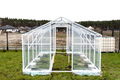 Assembling a home greenhouse from an aluminum frame and thick foil. - PhotoDune Item for Sale