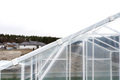 Assembling a home greenhouse from an aluminum frame and thick foil. - PhotoDune Item for Sale