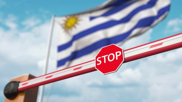 Opening Boom Barrier with Stop Sign at Flag of Uruguay