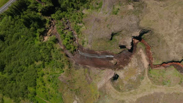 Aerial Birds Eye Overhead Top Down Ascending View of Stream Flowing Down on Rock