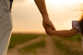 Father and daughter hold hands outdoors - PhotoDune Item for Sale